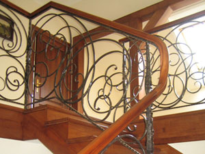 wrought iron railing with wooden handrails